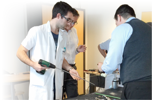 young doctor learning drill technique