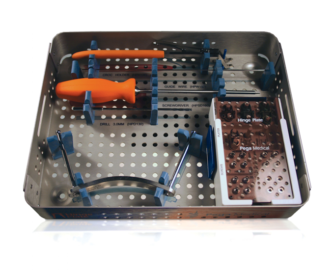 Surgical tray layout of the hinge plating system's instruments and implants